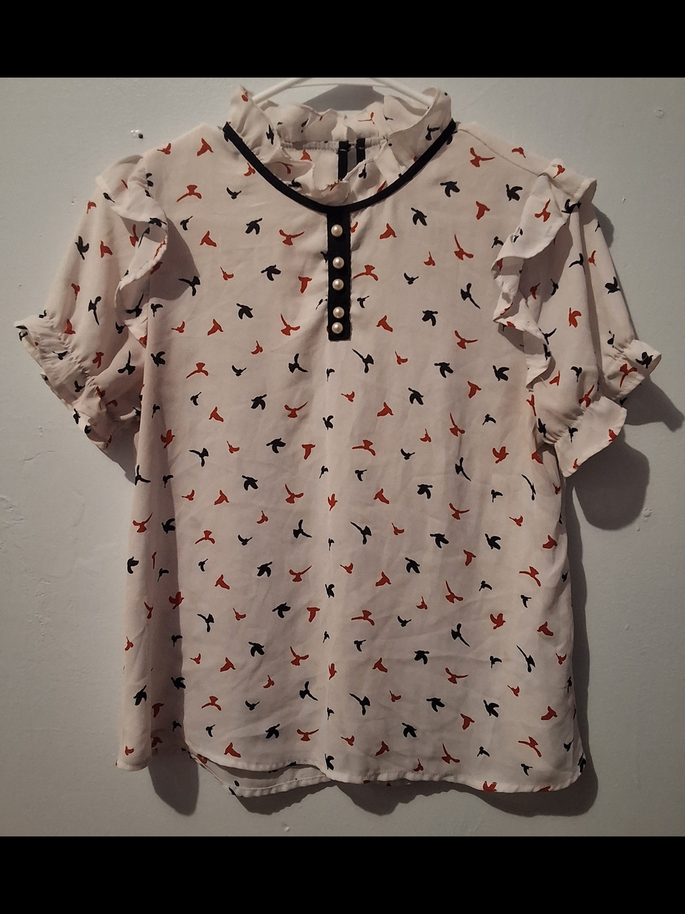 Miley + Molly Ivory Ruffle Neck Blouse with Black Trim & Rust Bird Print